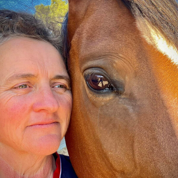 Close up photo of Michelle with her horse - About Three Red Ponies and Michelle